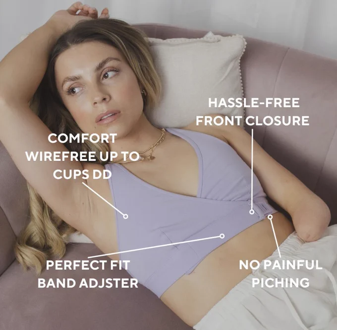 Gemma has a limb difference and is laying on a couch and wearing The Wrap Bralette. Text on top says "hassle-free front closure" "no painful pinching" "Perfect fit band adjuster" "comfort wire free up to cups DD"