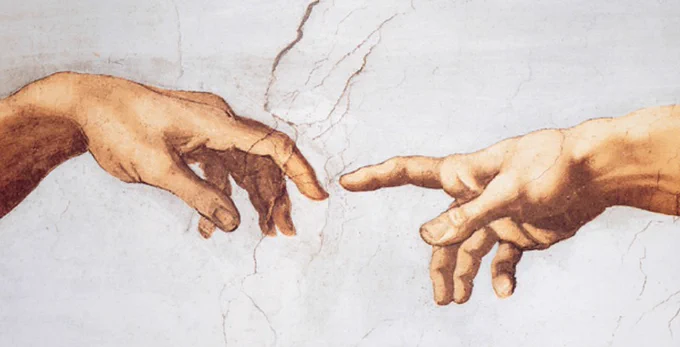 An image of connecting hands from the Sistine Chapel frescos