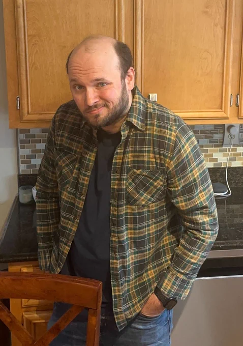 T-Mobile social team member recreating viral Kevin James pose