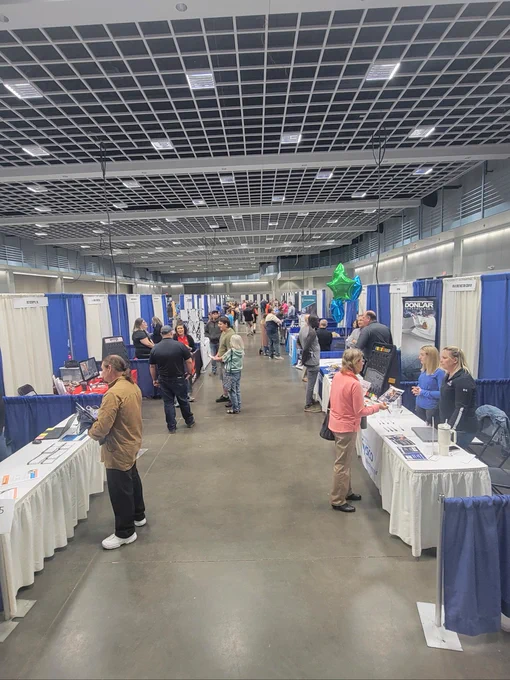 A crowd of job seekers speak with employers during the St. Cloud Area Career Fair. 