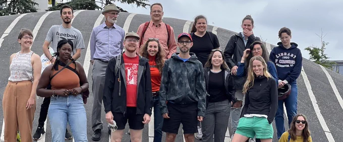 The study abroad students with instructors pose on a road