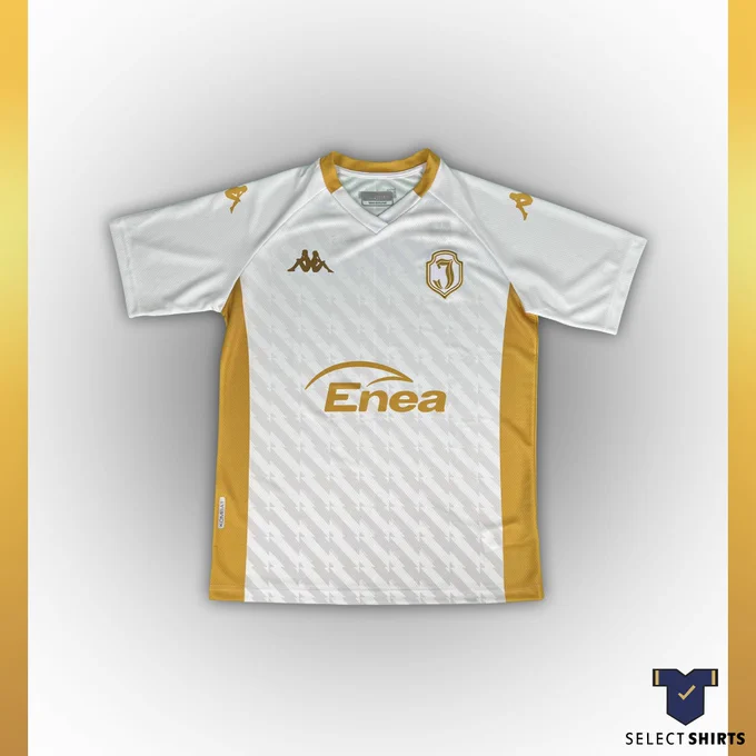 Jagiellonia's white & gold away shirt; a white body with gold tonal club badge, sponsor, collar and side panels.