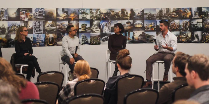 Four panelists sitting on benches at the front of a room.