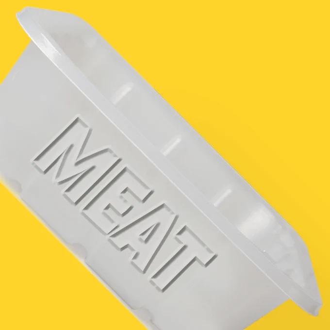 A graphic of a plastic tray with MEAT written on it.