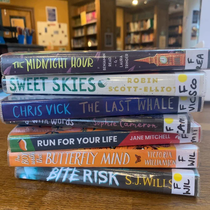 Pile of book club books being read by members this term.