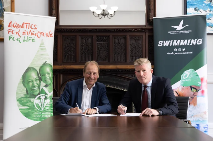 Professor Paul Boyle, Swansea University's Vice-Chancellor, and Swim Wales Chief Executive Officer Fergus Feeney signing the partnership agreement.