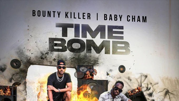 Baby Cham and Bounty Killer in sunglasses sitting on a burning soundsystem