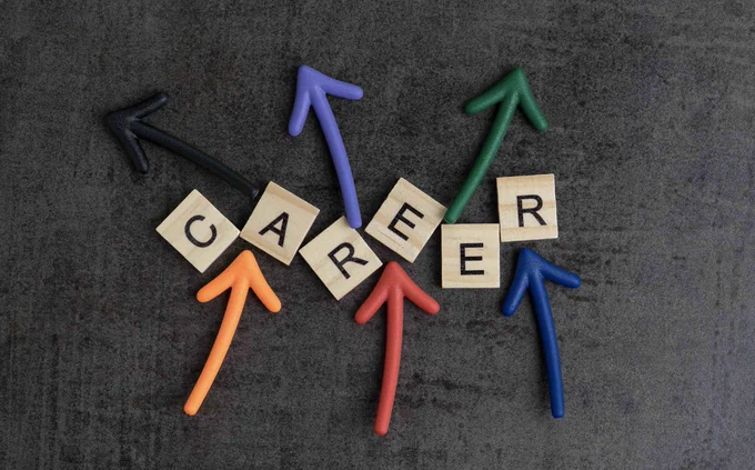 Tiles that spell out "CAREER" with multi-coloured arrows pointing in different directions