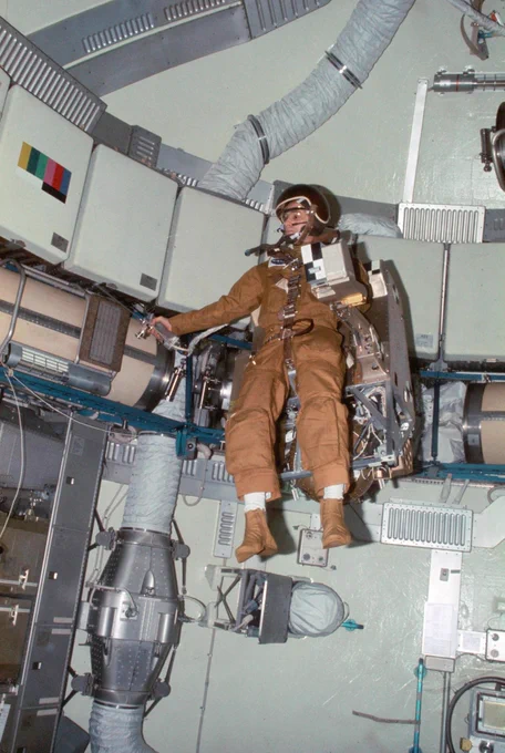 Astronaut Alan L. Bean, Skylab 3 commander, flies the M509 Astronaut Maneuvering Equipment in the forward dome area of the Orbital Workshop (OWS) on the Skylab space station cluster in Earth orbit. Bean is strapped into the back mounted, hand-controlled Automatically Stabilized Maneuvering Unit (ASMU). The dome area is about 22 feet in diameter and 19 feet from top to bottom. Photo credit: NASA