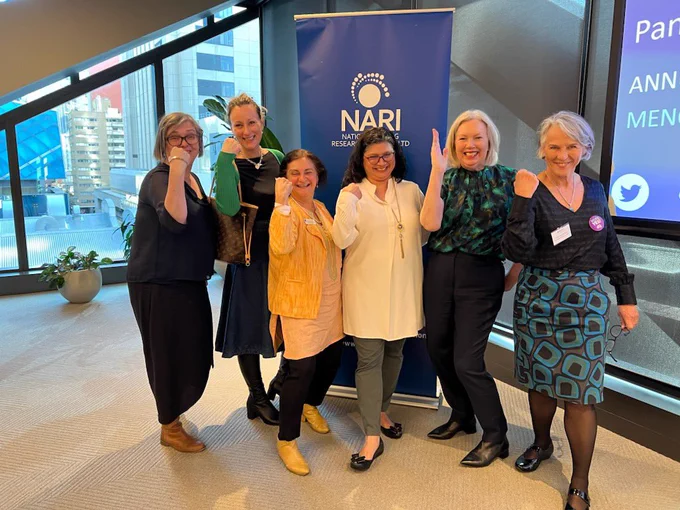 6 women posing for the camera