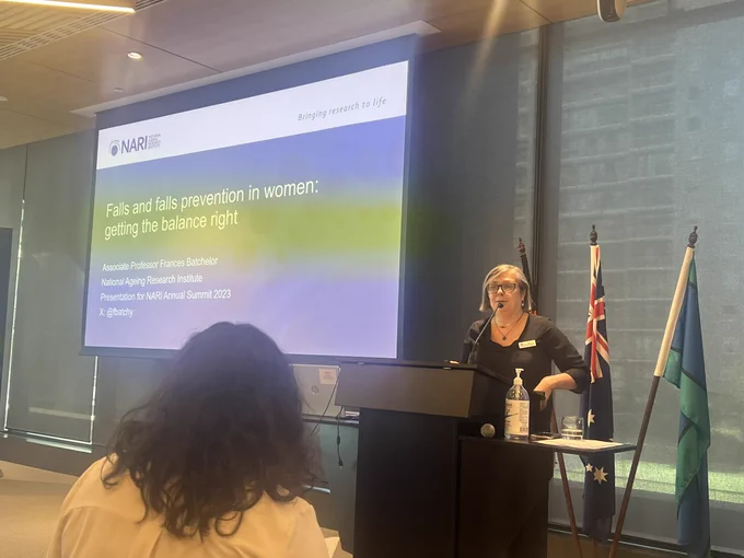 Woman talking at a lectern