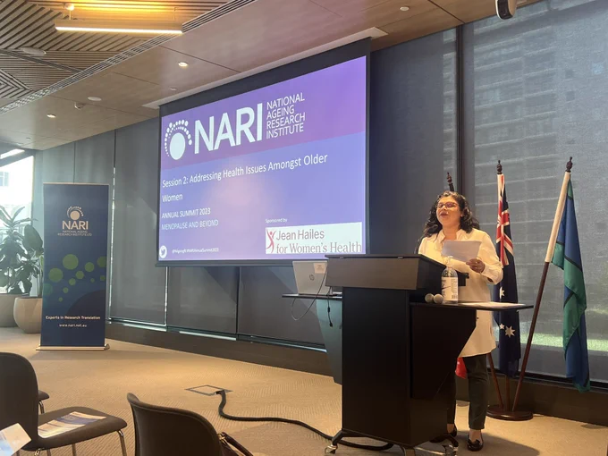 Woman talking at a lectern