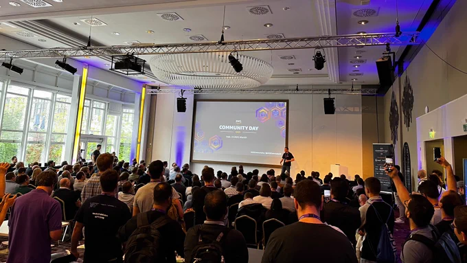 Stage and audience at AWS Community Day