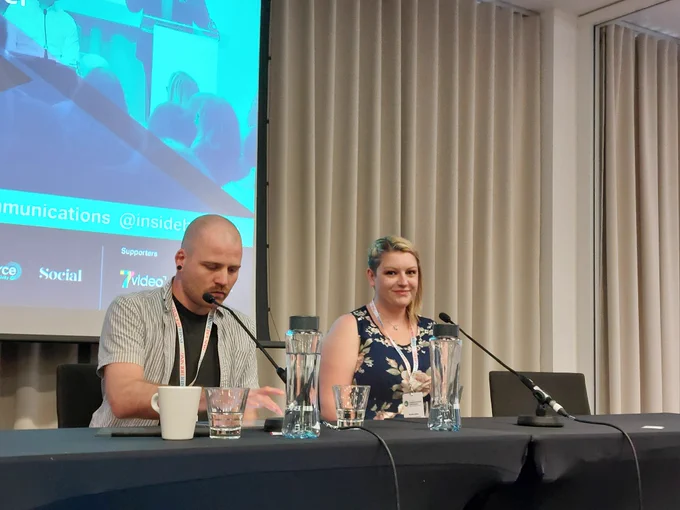 Co-creation and Innovation Manager at Southern Housing, Lewis Kinch and Eastlight's Customer Influence Committee Chair & Board Member, Michelle Baker, are sat next to each other on the panel at Inside Housing's Communications conference. Michelle is smiling at the camera whilst Lewis is looking down at the table.
