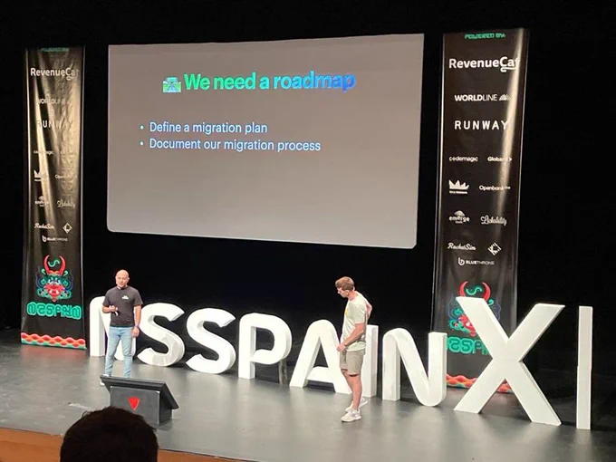 The speakers on stage while giving the presentation.