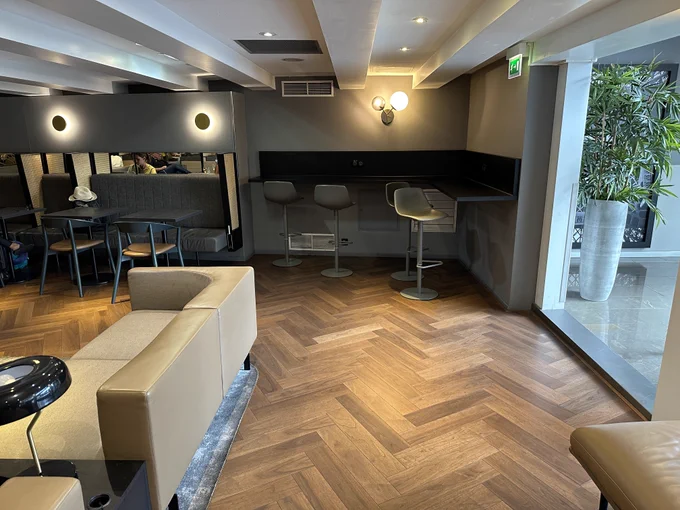 A low ceiling and dim lighting colour the lounge experience.