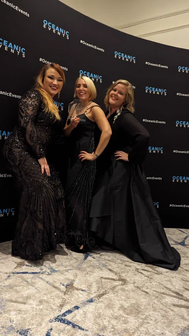 Hannah Schlesinger Brodie and colleagues Hannah and Ieva receiving the award for Achievements in Art & Culture at the Scottish Women’s Awards 2023. They are wearing evening dresses, with lots of sparkle, ready to celebrate and dance the night away!