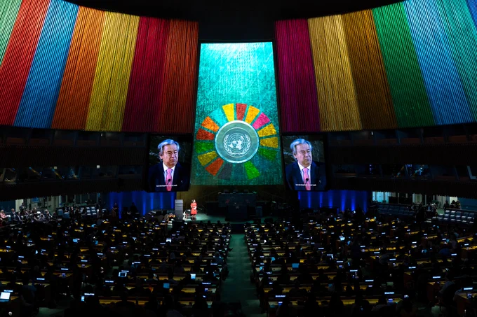 A wide view of the United Nations General Assembly Hall during the opening of the SDG Action Weekend and the SDG Mobilization Day. Two screens on the sides display a video of Secretary-General António Guterres delivering remarks.