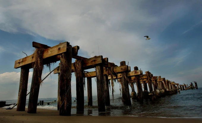 Remnants of a fishing pier are photographed after Hurricane Isabel.