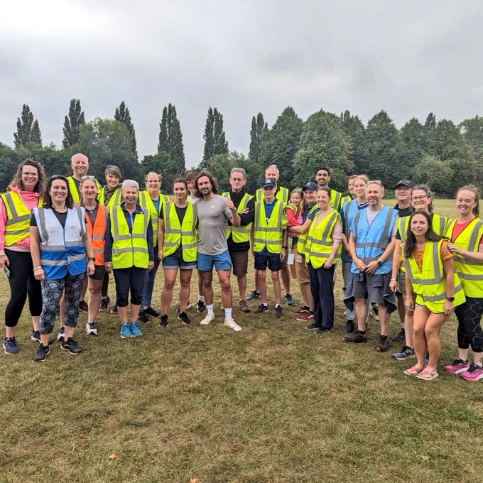 Group picture of Joe Wicks and volunteers at Laleham junior parkrun