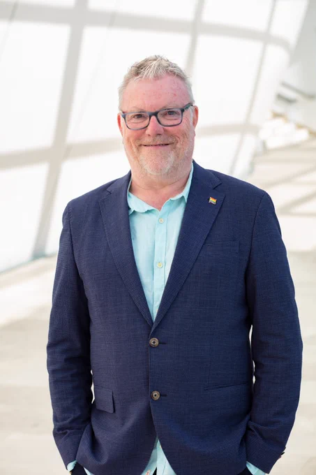 Portrait of white man against museum background