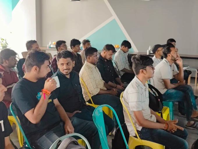 BrowserStack Mumbai Meetup, people sitting and watching a presentation