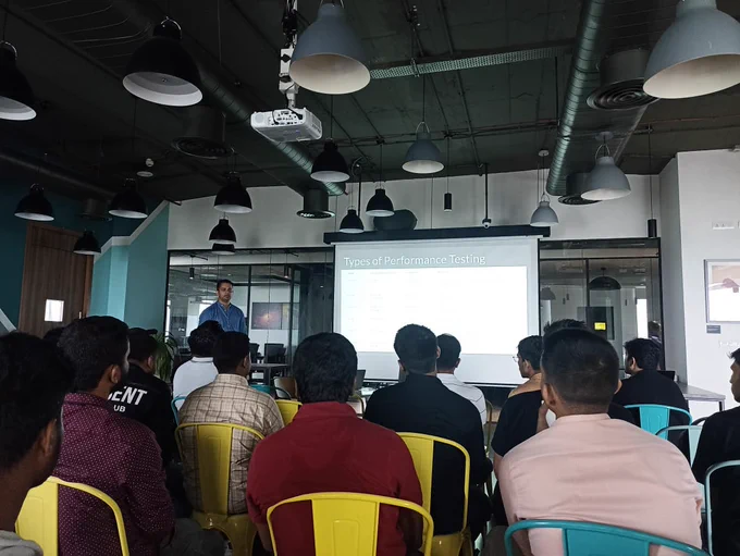 BrowserStack Mumbai Meetup, people sitting and watching a presentation