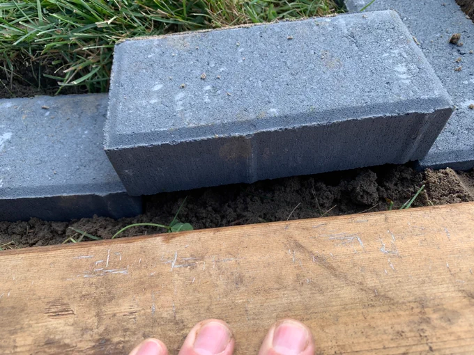 A brick doesn't fit into the space for it. A millimeter or two rests on top of the neighbouring bricks.