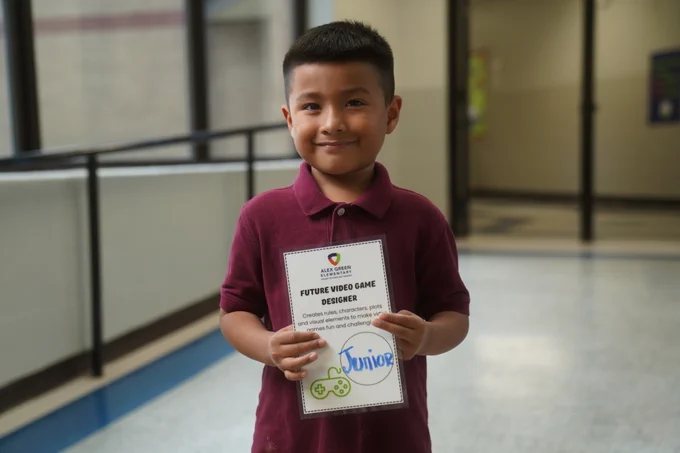 Student holding certificate
