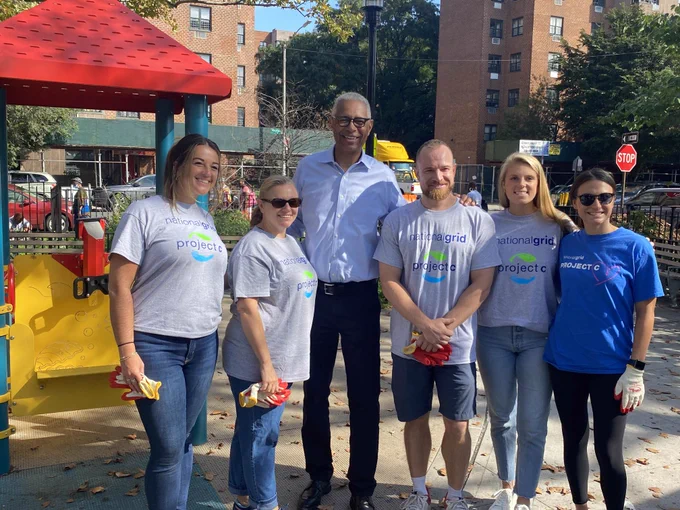 Rudy Wynter with employees at a Week of Service event in Brooklyn