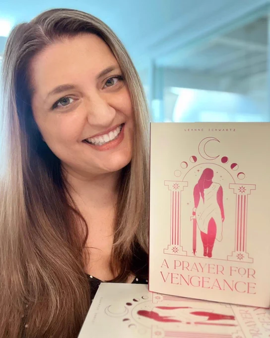 Me smiling with my book A PRAYER FOR VENGEANCE