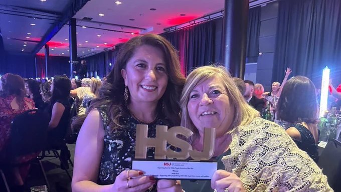 Our two amazing colleagues - Lenah and Mandy collecting the HSJ award.
