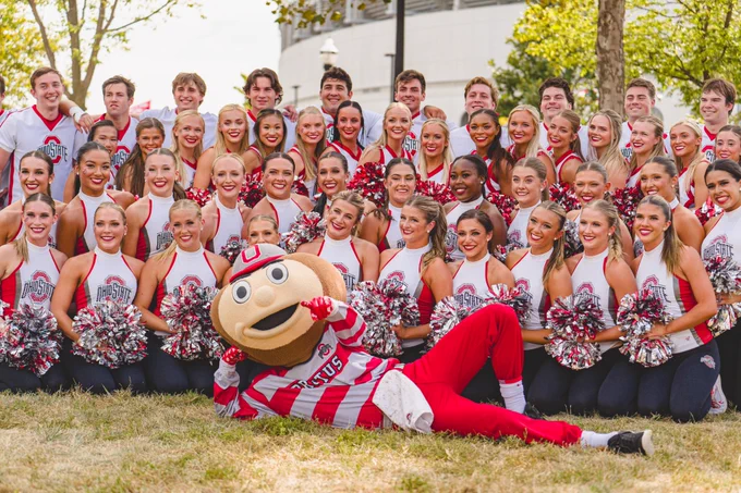 Ohio State Dance and Cheer Teams posing with Brutus Buckeye