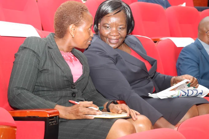 Dr. Penninah Musinga, Head Librarian at Amref International University, engaging with Dr. Roselida Owuor from the Department of Higher Education, Kenya