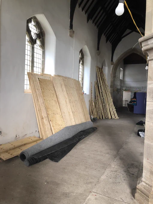 The disassembled floor stacked against the wall