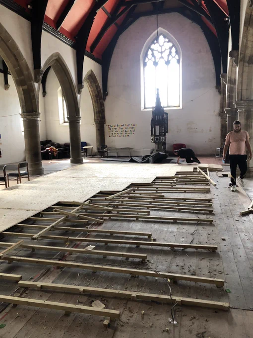 A partially dismantled temporary floor in a church