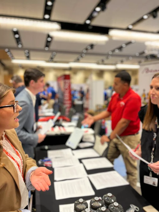Employers talking to students at engineering and computer science career fair.
