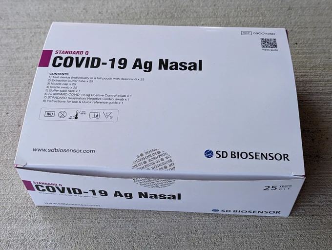 A box of SD Biosensor COVID test kit containing 25 RATs