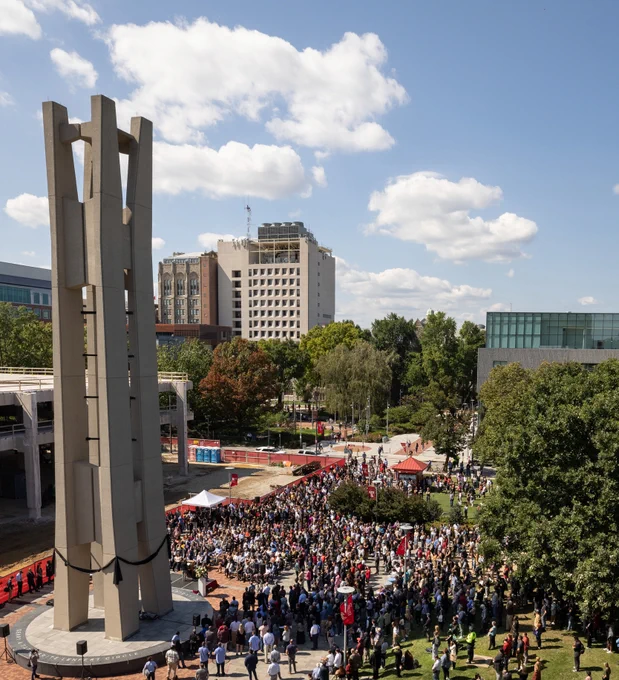 an ariel of the bell tower showing crowds of people gathering