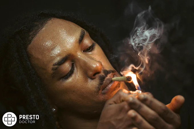 man smoking cigarette in close up photography, cannabis and hair loss