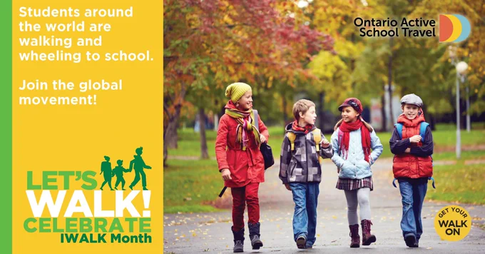 Four friends smiling and walking to school together. The caption reads: “Students around the world are walking and wheeling to school. Join the global movement!”. 