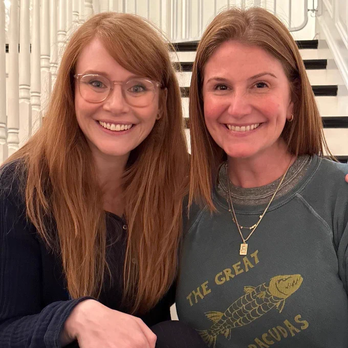 BDH (left) sits next to her god sister Zoe (right) on a staircase. The two are as close as can be — in proximity, friendship, and hair type.