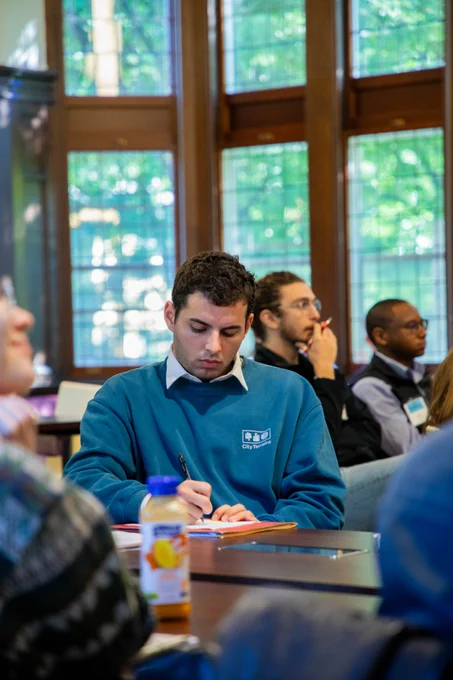 DivEx participant writes in a notebook.