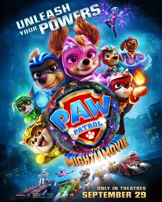 The poster for PAW PATROL: THE MIGHTY MOVIE shows a variety of dogs in superhero costumes gathered behind a shield with the words "PAW PATROL" on it. The tagline reads "Unleash your powers," and at the bottom are the words "Only in theaters September 29." The background is a cityscape with a number of sci-fi vehicles at the bottom and a small human form with purple glowing hands at the top.
