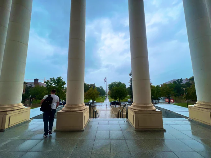 Photo from the front door of the Park Building looking west out on a rainy Presidents Circle.