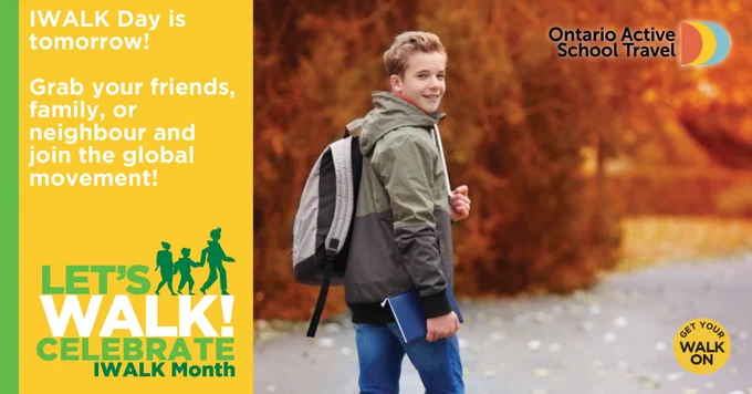 A student smiles at the camera as he walks to school. The caption reads “IWALK Day is tomorrow! Grab your friends, family, or neighbour and join the global movement!” 