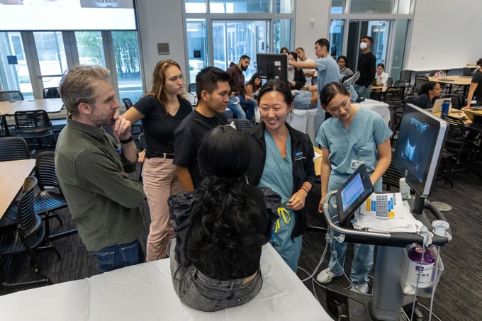 Medical students learn how to use an ultrasound