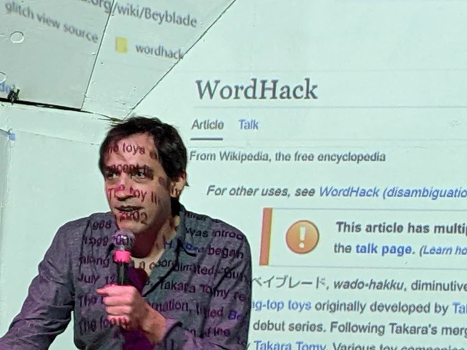Todd Anderson introducing WordHack with projection of a WordHack wikipedia page