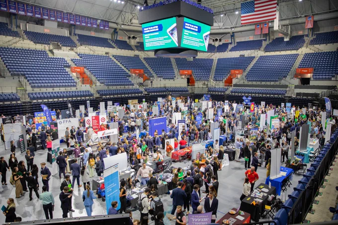 A wide photo of the floor of the Stephen C O’Connell Center that showcases the hundreds of students and employers at Career Showcase.
