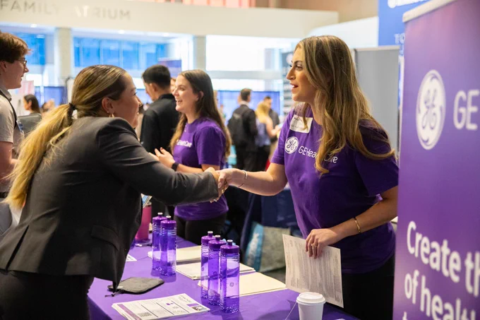 A recruiter and a candidate shake hands at GE